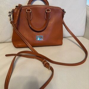 Dooney Bourke nice thick leather bag. Hand or Strap for crossbody
